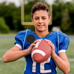 boy holding football