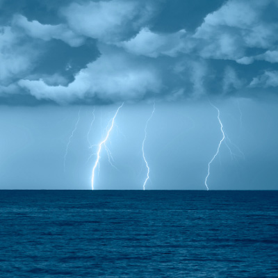 lightning in the distance of the ocean