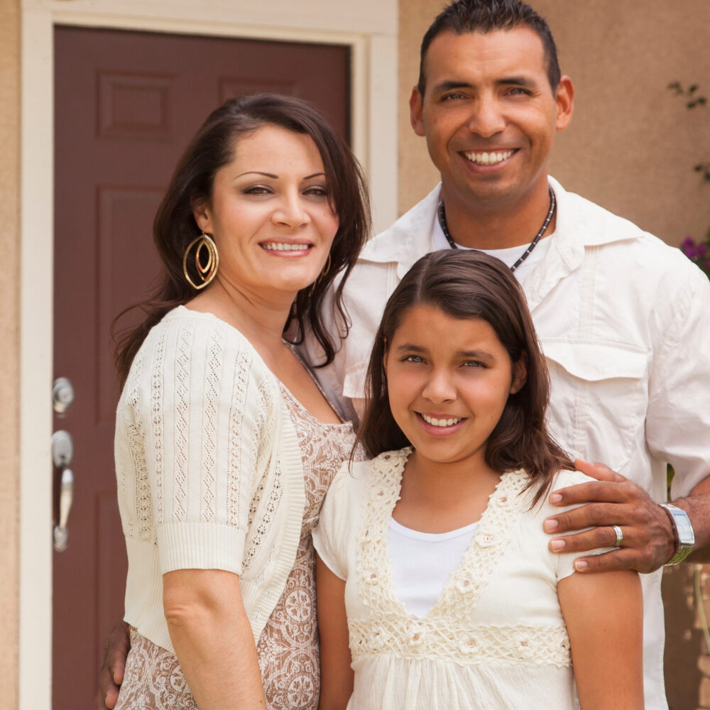 Family in front of their house